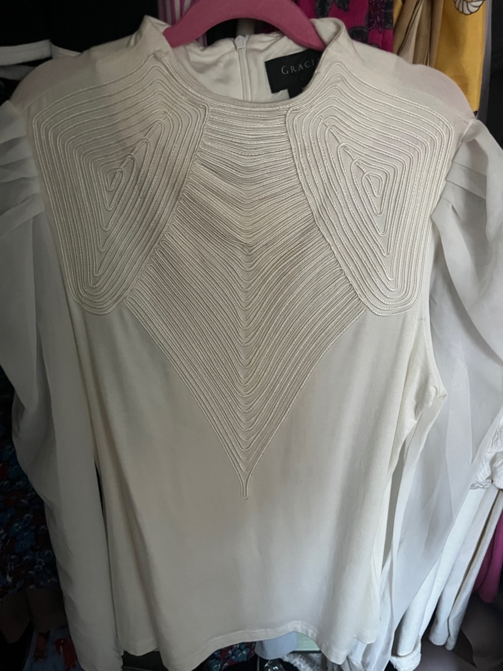 Structured top with sheer sleeves
